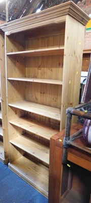 Lot 1011 - A pine bookcase with five adjustable shelves,...