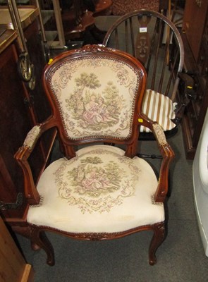 Lot 1037 - A wheelback open armchair with solid wood seat,...