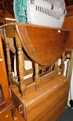 Lot 1026 - An oak drop leaf dining table, gate leg...
