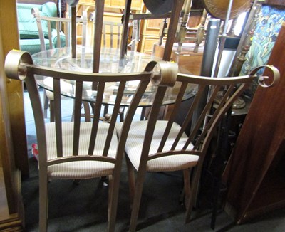 Lot 1053 - A circular glass topped metal dining table,...