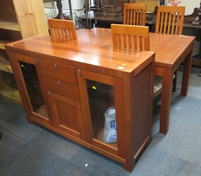 Lot 1062 - A modern rectangular extending dining table...