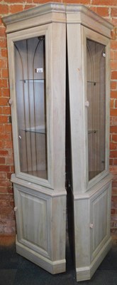 Lot 1055 - A pair of limed oak corner display cabinets,...
