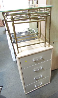 Lot 1070 - A four drawer chest, finished in limed oak and...