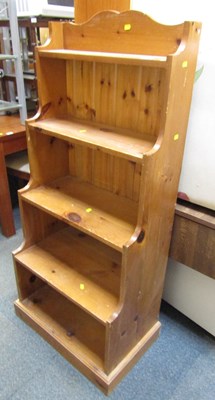 Lot 1076 - A pine waterfall bookcase, of four...