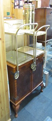 Lot 1079 - A brass and copper umbrella stand, raised on...