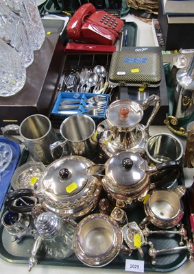 Lot 2029 - Metalware, in the form of flatware, teapots,...