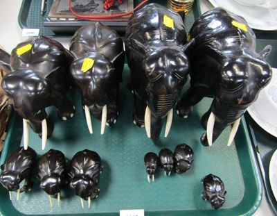 Lot 2045 - Carved hardwood and ebonised elephants, one...