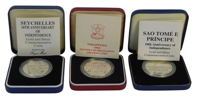 Lot 73 - Three Royal Mint silver proof coins,...
