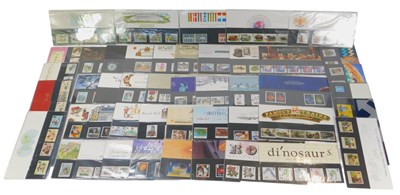 Lot 263 - Fifty Royal Mint Stamp Presentation Packs, to...