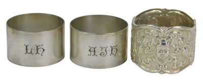 Lot 281 - A pair of George VI silver napkin rings, of...