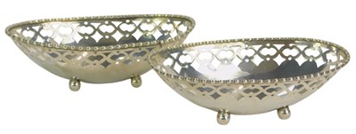 Lot 288 - Two 20thC white metal dishes, of oval pierced...