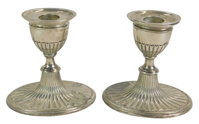 Lot 286 - A pair of Victorian silver loaded candlesticks,...