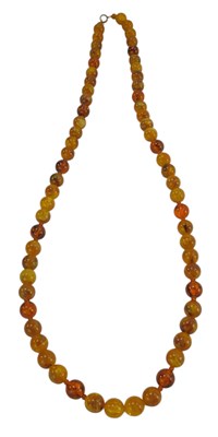 Lot 267 - A simulated amber bead necklace, on a bolt...