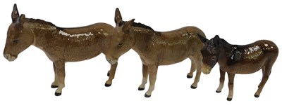 Lot 364 - Three Beswick donkeys, the largest 13.5cm high.