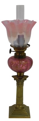 Lot 370 - A Victorian brass oil lamp, with a pink...