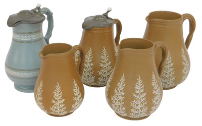 Lot 224 - Five late 19thC earthenware jugs, four brown...