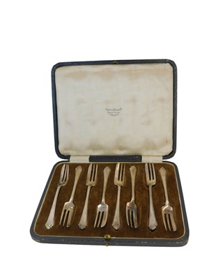 Lot 411 - A set of eight George VI silver cake forks,...