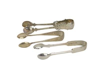 Lot 419 - Three pairs of silver sugar tongs, Sheffield...