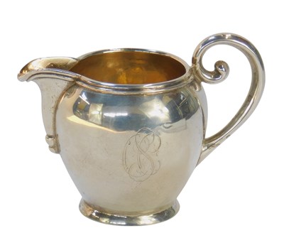 Lot 421 - A late 19thC Continental cream jug, of bulbous...