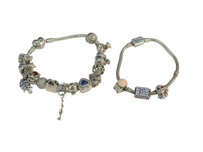 Lot 424 - A Pandora silver charm bracelet, bearing...