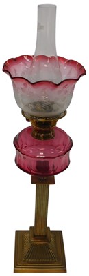 Lot 445 - A late Victorian brass oil lamp, with a clear...