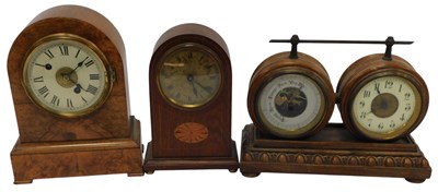 Lot 446 - An early 20thC walnut cased mantel clock, the...