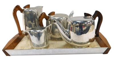 Lot 477 - A harlequin four piece Piquot ware tea service,...