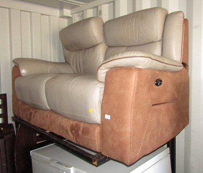 Lot 1110 - A two seater electric reclining sofa.