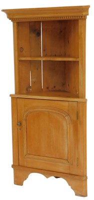 Lot 556 - A Victorian pine corner cabinet, the top with...