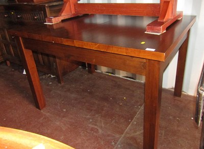 Lot 1117 - An extending rectangular topped dining table,...