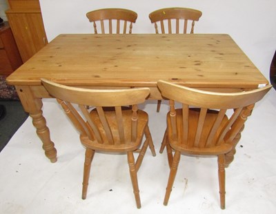 Lot 1123 - A pine dining table, and a set of four lath...