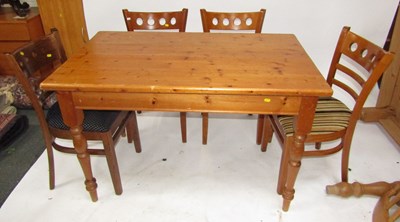Lot 1124 - A pine kitchen table, raised on turned...