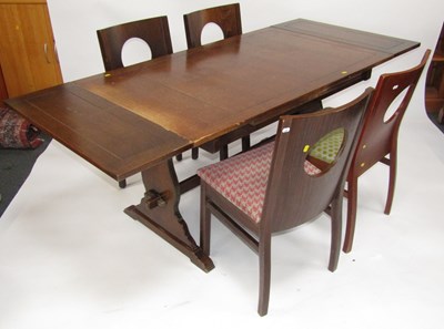 Lot 1126 - An oak draw leaf dining table, raised on lyre...