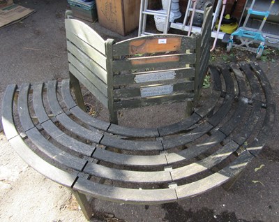 Lot 1140 - A tree garden seat, semi-circular in form.
