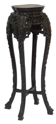 Lot 595 - An Oriental carved hardwood jardiniere...