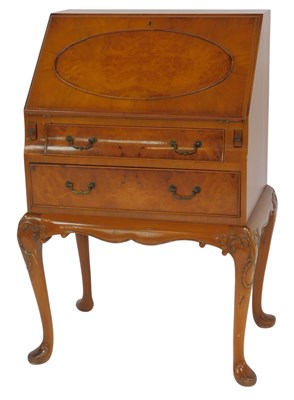 Lot 597 - A 20thC walnut bureau, the fall enclosing four...