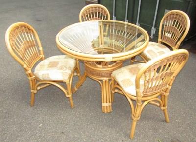 Lot 1090 - A glass-topped bamboo and rattan style...