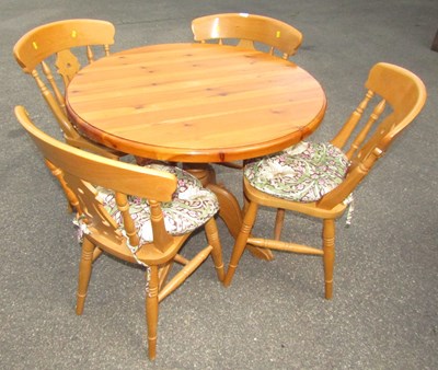 Lot 1091 - A pine circular table, raised on pedestal, and...