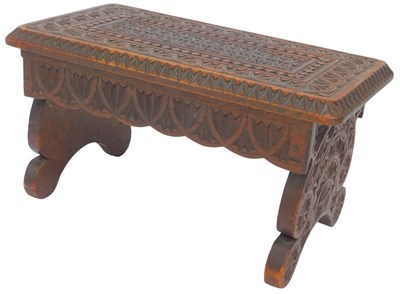 Lot 614 - A Victorian carved hardwood footstool, on...