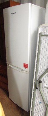 Lot 1098 - A Hoover fridge freezer, finished in white....