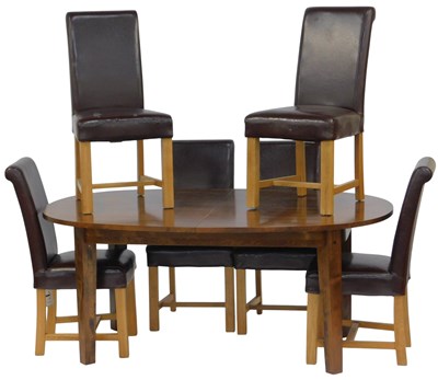 Lot 630 - A Laura Ashley hardwood extending dining table,...