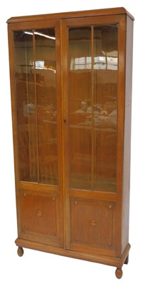 Lot 571 - An early 20thC oak display cabinet, the top...