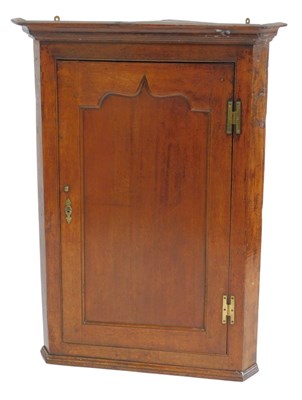 Lot 594 - A Georgian oak hanging corner cabinet, the top...