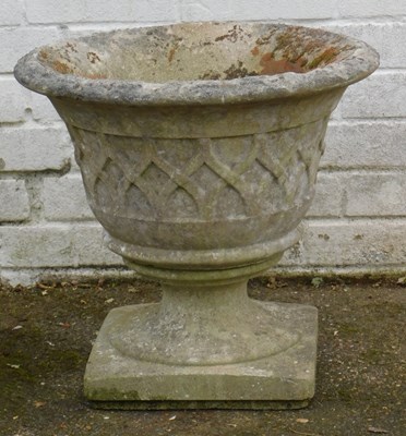 Lot 659 - A reconstituted stone garden planter, of...