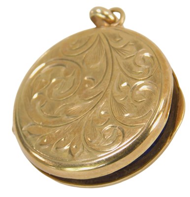 Lot 539 - A 9ct gold locket, of circular form, decorated...
