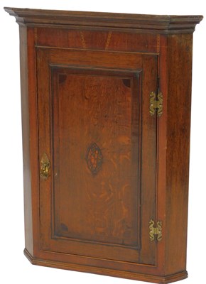 Lot 667 - A 19thC oak corner cabinet, the top with a...