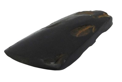 Lot 548 - A Stone Age flint axe head, 11cm wide.