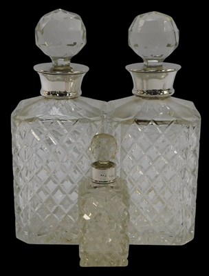 Lot 686 - A pair of Elizabeth II glass decanters, each...
