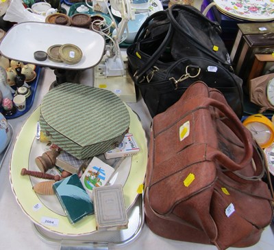 Lot 2084 - Two bags containing Crown Green bowls, an...