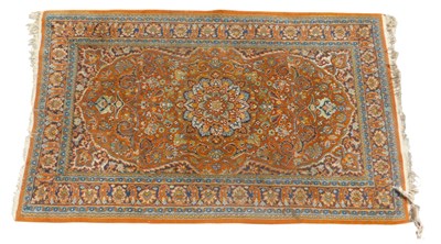 Lot 690 - A Persian rug, orange ground, with central...
